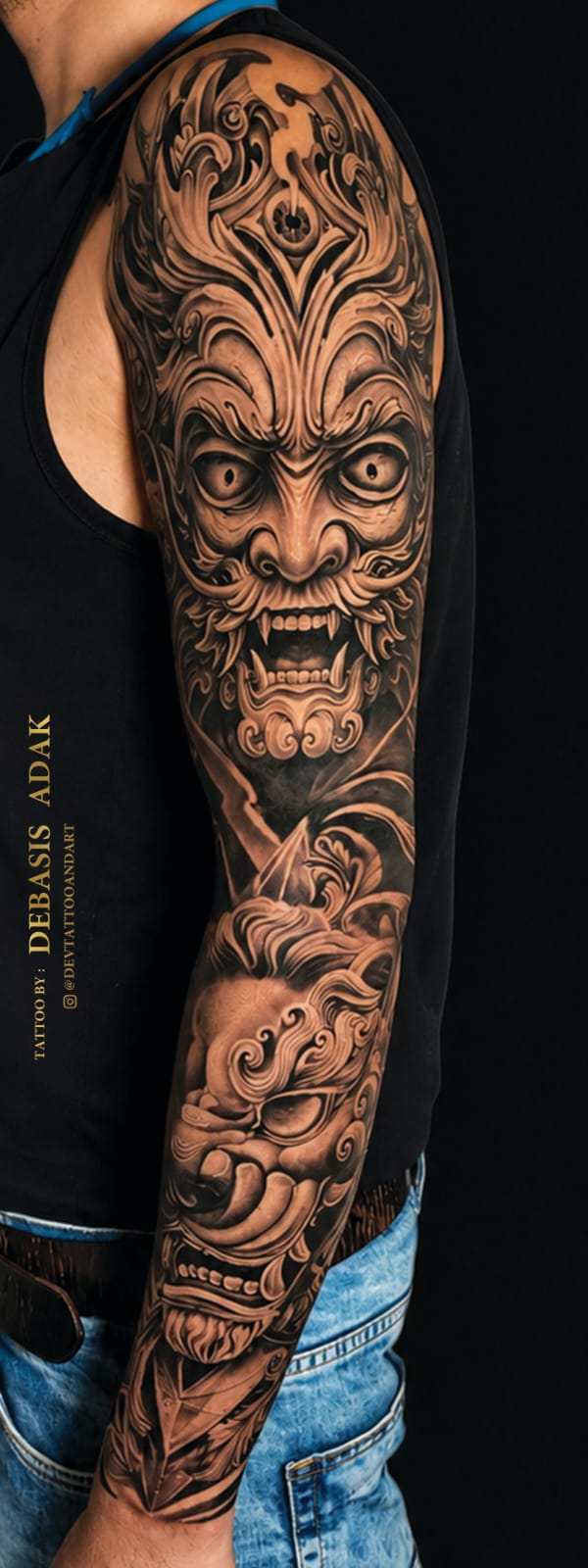 Ornamental Oni demon and foo dog full sleeve black and grey tattoo by Debasis Adak, Dev Tattoo & Art Kolkata