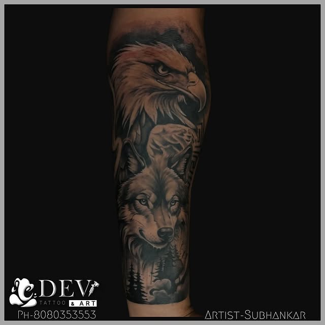 Eagle and wolf black and grey realism forearm tattoo by Subhankar, Dev Tattoo & Art Kolkata