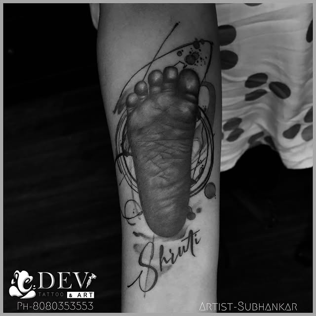 Baby footprint memorial forearm tattoo by Subhankar, Dev Tattoo & Art Kolkata