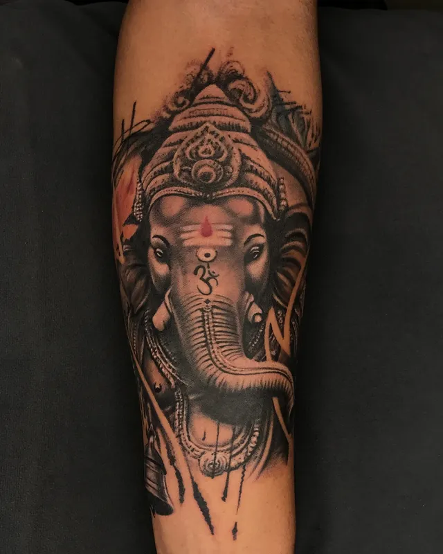 Lord Ganesha detailed black and grey forearm tattoo, Dev Tattoo & Art Kolkata