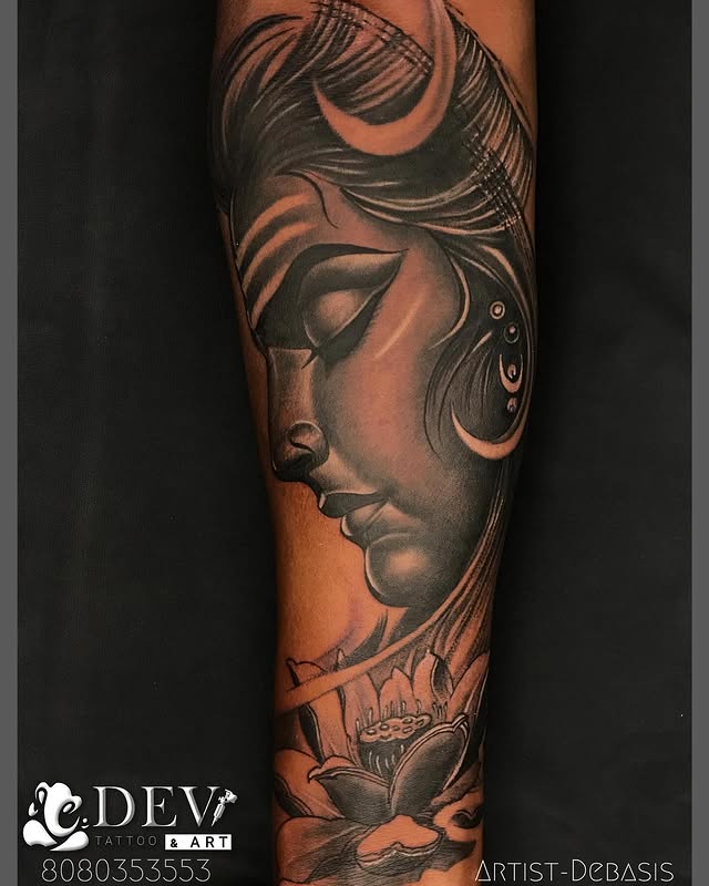 Lord Shiva side profile with lotus forearm sleeve by Debasis, Dev Tattoo & Art Kolkata
